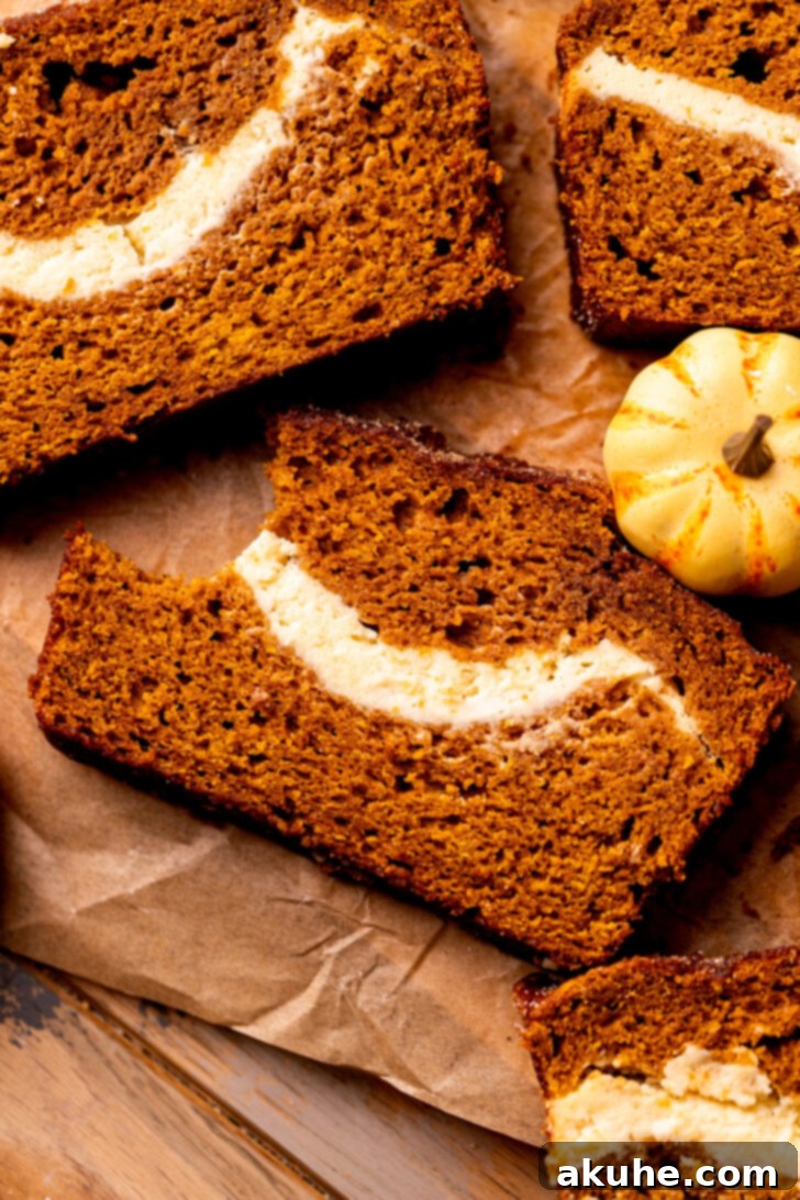 Cream Cheese Swirled Pumpkin Bread 10 Pumpkin cream cheese bread with a bite missing, tempting and delicious.
