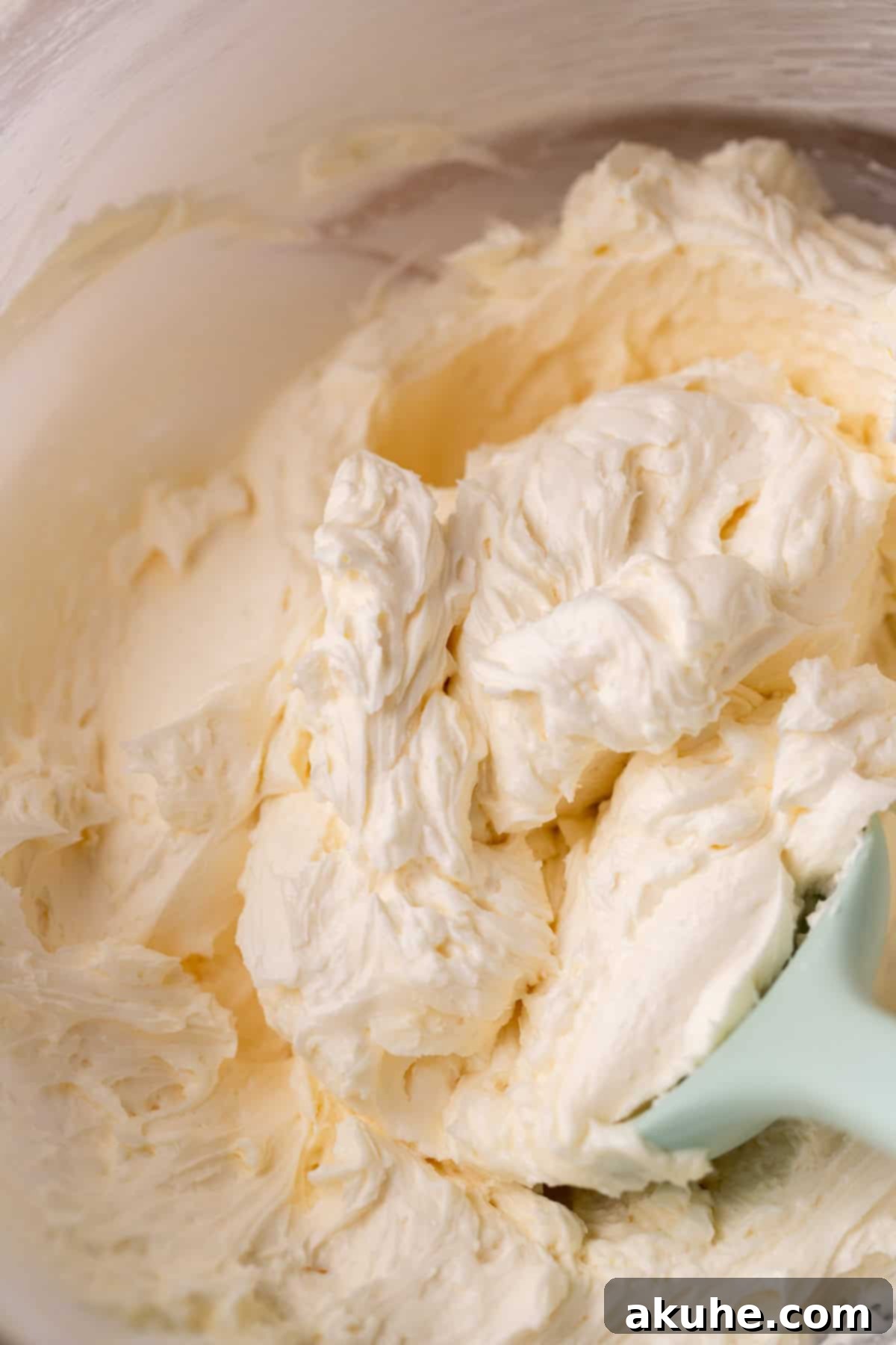 Spiced Pumpkin Oatmeal Cream Pies 7 Creamy marshmallow frosting, light and fluffy, presented in a glass bowl.