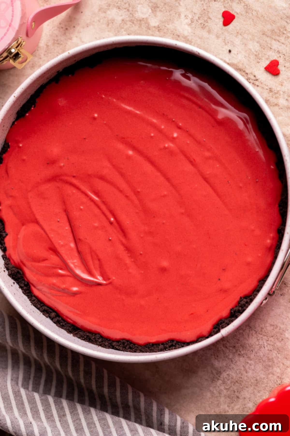 Red Velvet Decadence 7 Red velvet cheesecake batter spread evenly in the springform pan.