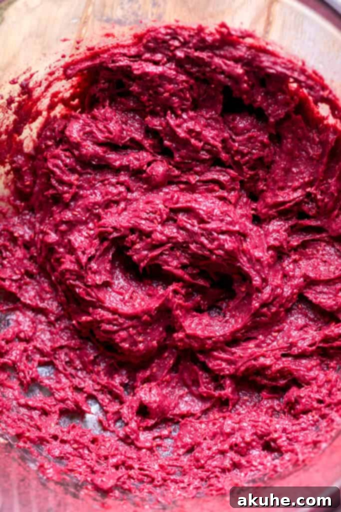 Raspberry Chocolate Cloud Cake 6 Raspberry pudding mixture in a glass bowl before folding in whipped cream.