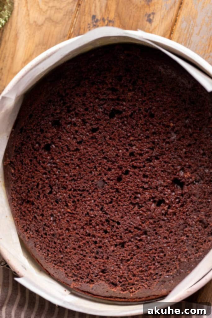 Raspberry Chocolate Cloud Cake 8 Chocolate cake placed in a parchment-lined springform pan.