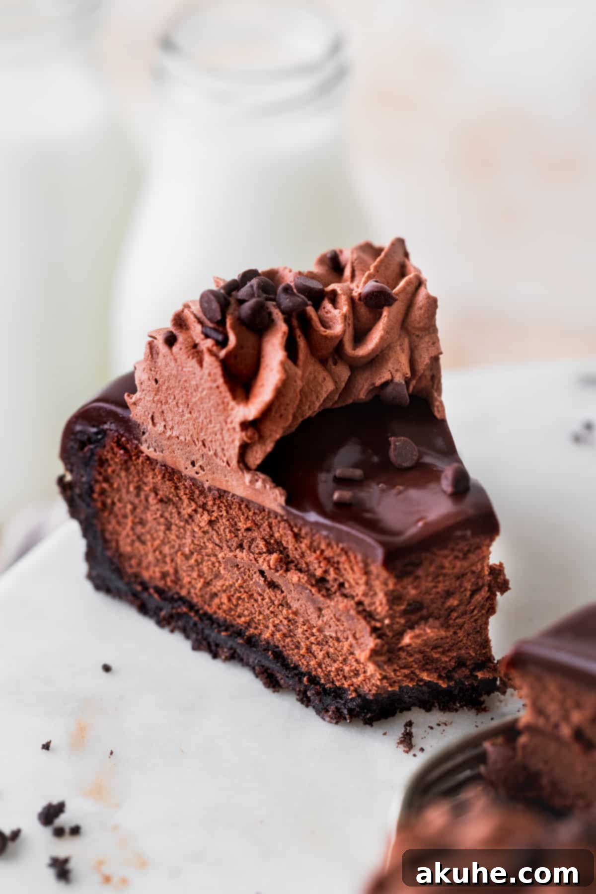 Decadent Triple Chocolate Cheesecake 2 Close up of a perfect slice of triple chocolate cheesecake revealing its multiple layers.