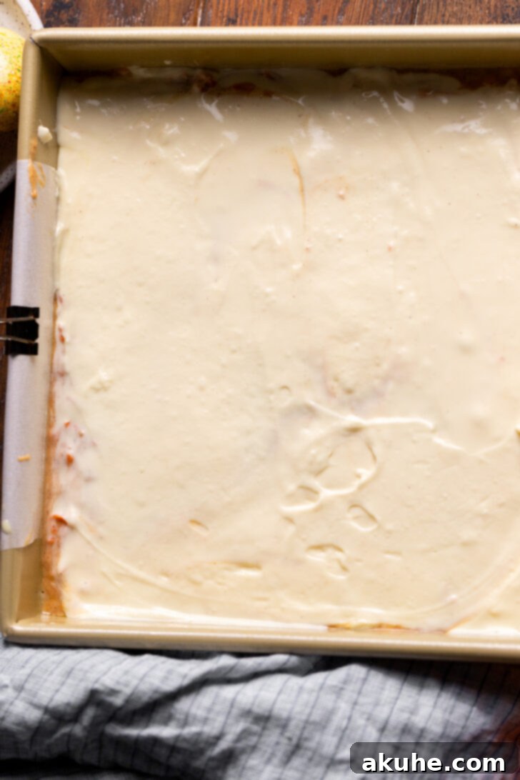 Spiced Carrot Coffee Cake 8 Smooth, even layer of cream cheese over the cake batter in the pan.