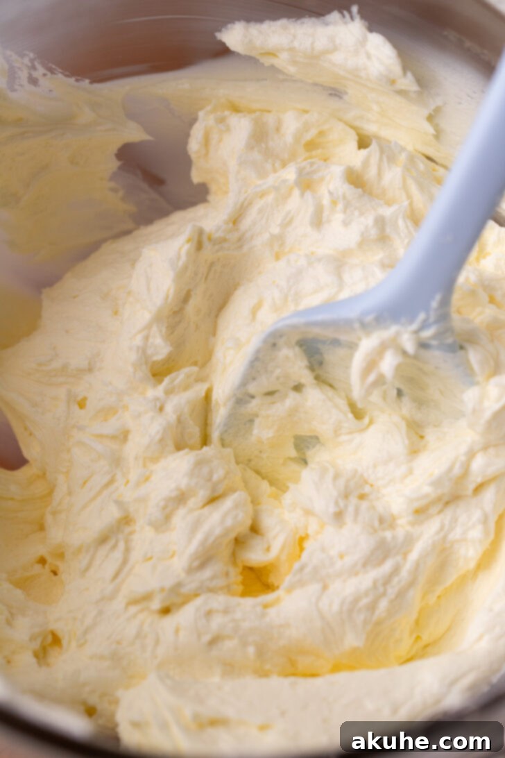 Luscious Chocolate Cream Cheese Frosting 5 Whipped butter and cream cheese in a glass bowl.