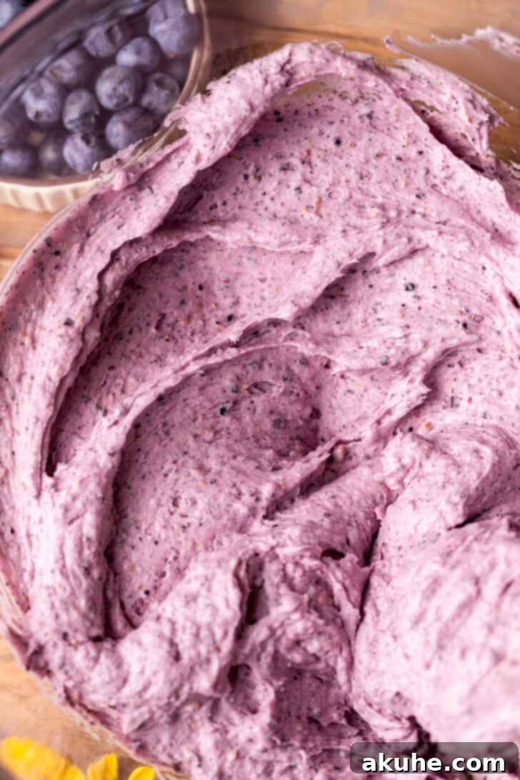 Velvety Blueberry Buttercream 3 Close-up of the smooth, vibrant texture of creamy blueberry cream cheese frosting.