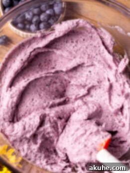 Velvety Blueberry Buttercream 7 Blueberry frosting in a glass bowl.