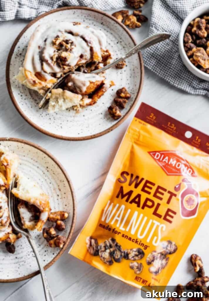 Nutty Cinnamon Swirls 3 Soft, decadent walnut cinnamon rolls served on individual plates, ready to be enjoyed.