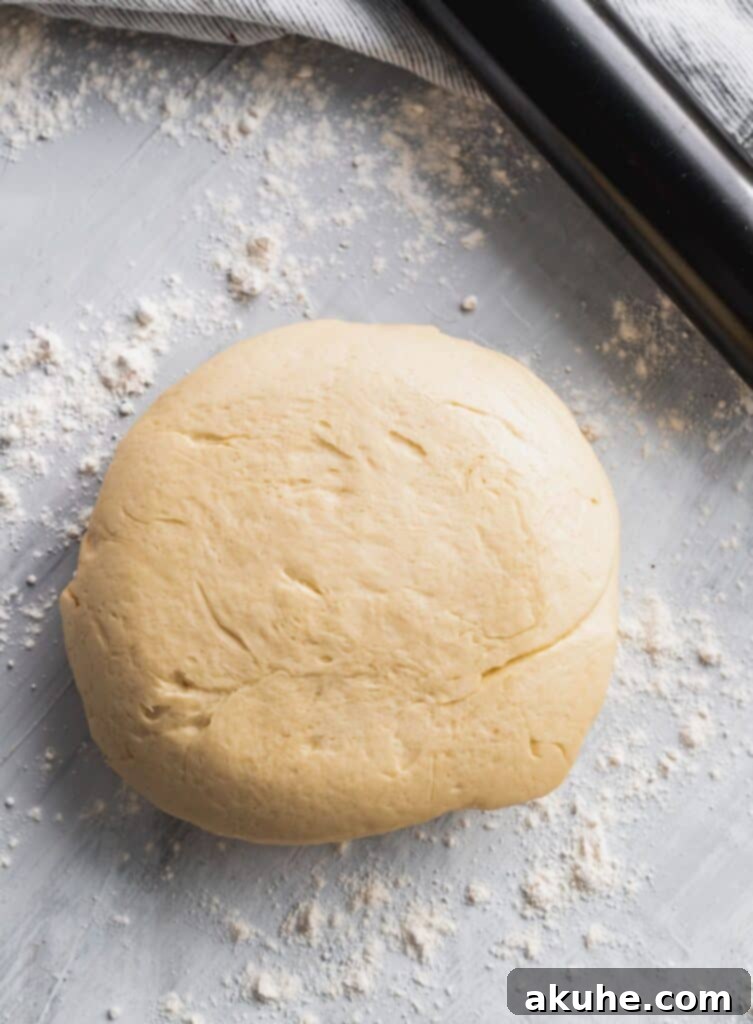 Nutty Cinnamon Swirls 6 Cinnamon roll dough ready to be rolled out after its first rise.