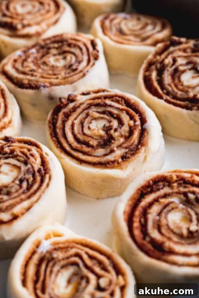 Nutty Cinnamon Swirls 9 Cinnamon rolls soaking in heavy cream before baking.