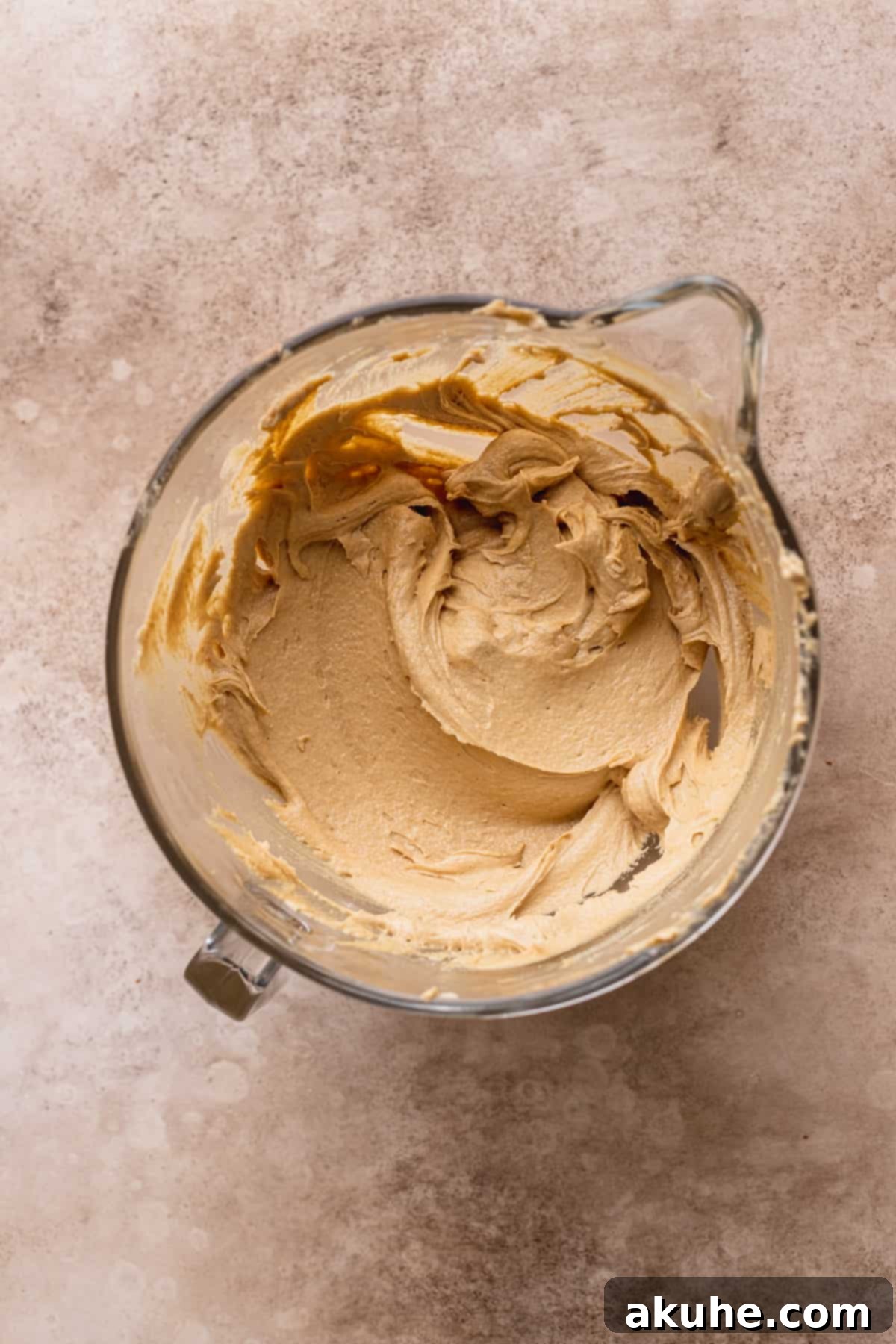 Perfect Peanut Butter Chocolate Chip Cookies 4 Wet ingredients in a bowl, after creaming butter and sugars, and adding peanut butter, vanilla, and eggs.