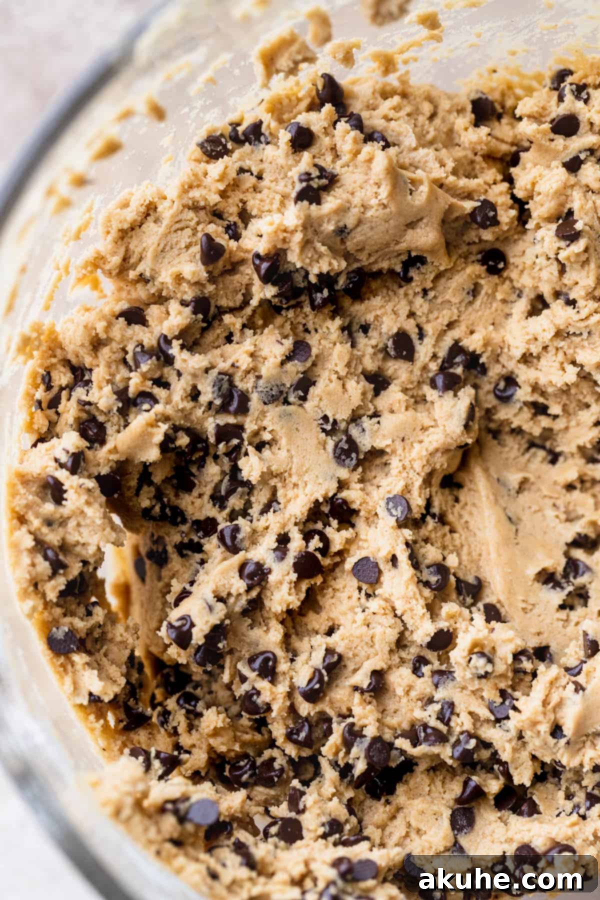 Perfect Peanut Butter Chocolate Chip Cookies 6 Cookie dough in a glass bowl, perfectly mixed and ready for chilling.