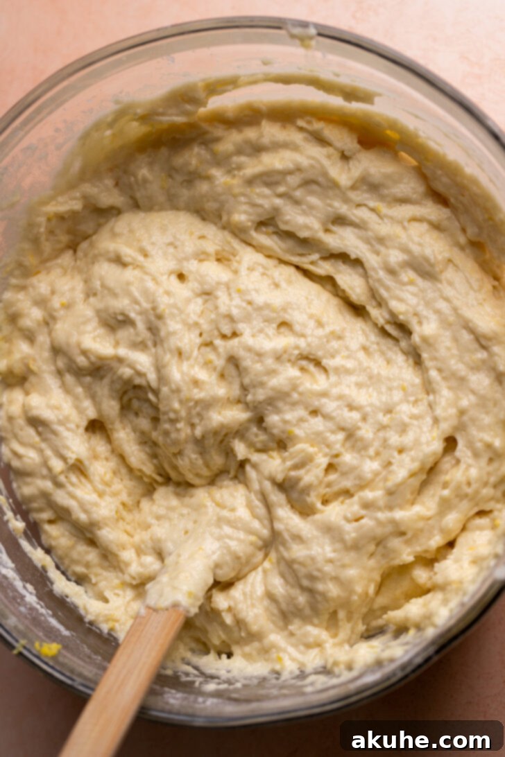 Lemon cake batter in a bowl, showing its thick consistency.