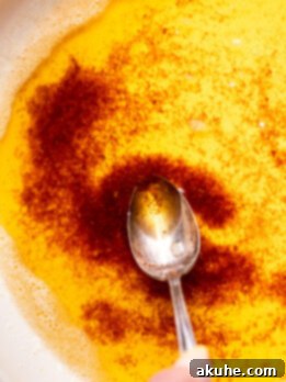 Achieving Golden Brown Butter 11 Spoon inserted into brown butter, illustrating the final product.