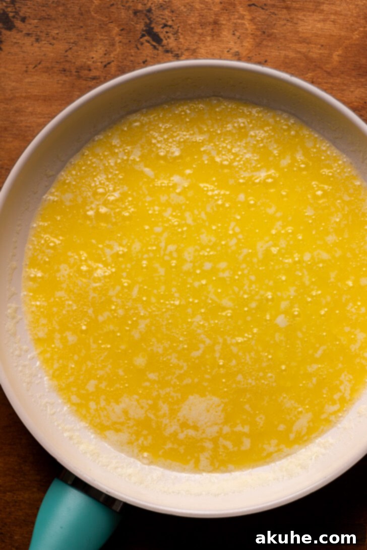 Achieving Golden Brown Butter 5 Melted butter in a pan, actively bubbling as water content evaporates.