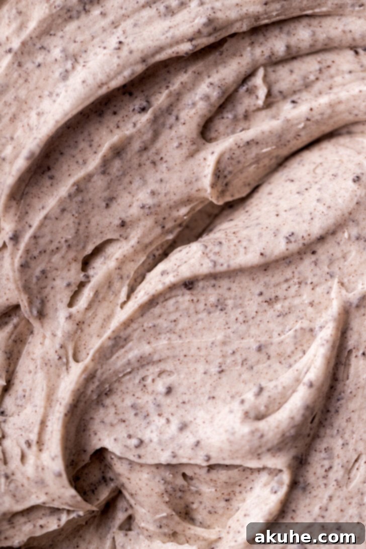 Oreo Cookie Cream 2 Close-up of fluffy Oreo frosting in a bowl, showing texture and cookie crumbs.