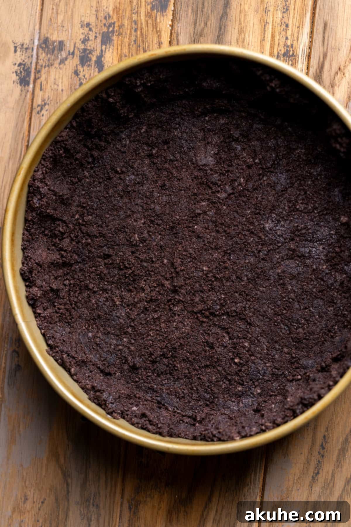 Peppermint Bark Cheesecake 4 A perfectly formed Oreo cookie crust resting in a springform pan, ready for the cheesecake filling.