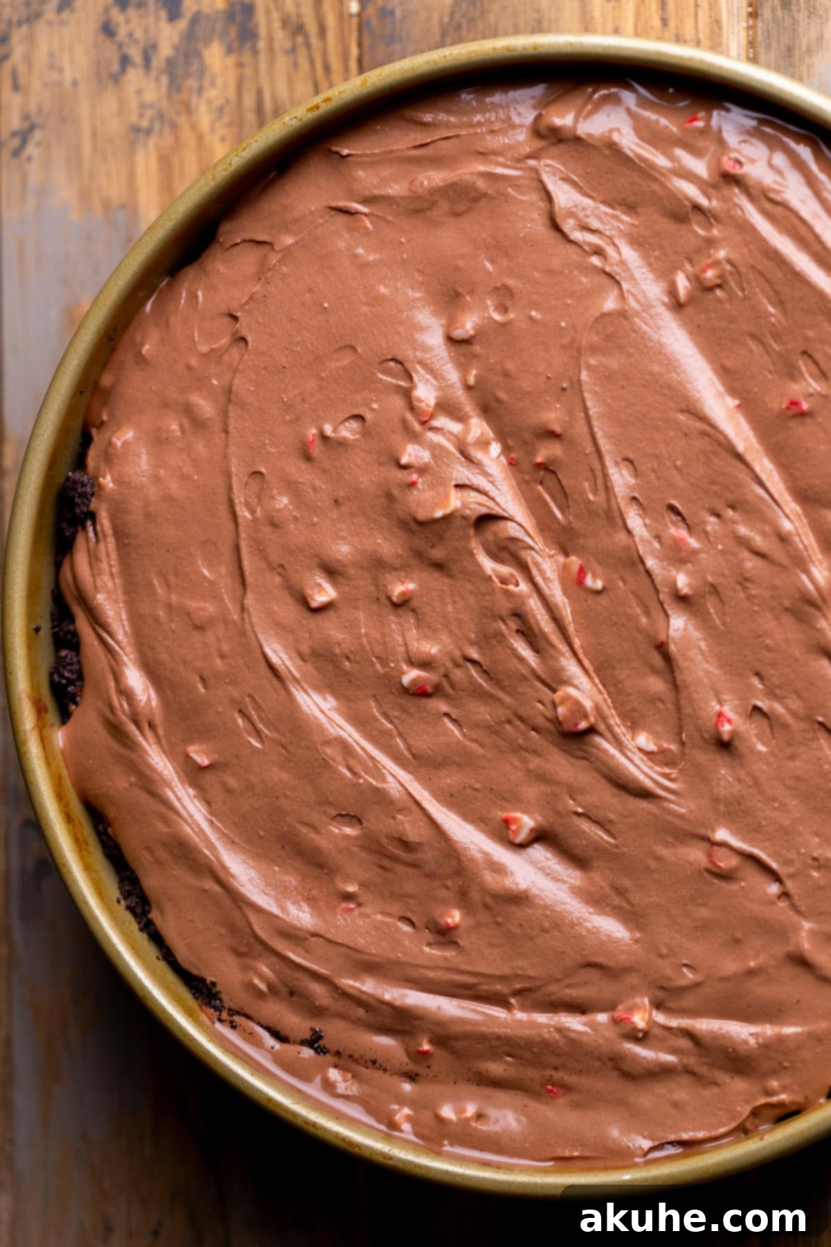 Peppermint Bark Cheesecake 7 Unbaked chocolate cheesecake batter, smooth and ready, resting in a springform pan.