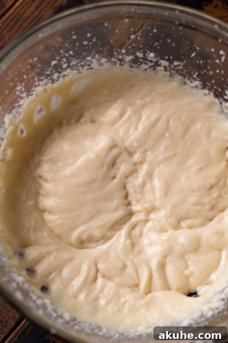 Wet ingredients for the cake in a mixing bowl.