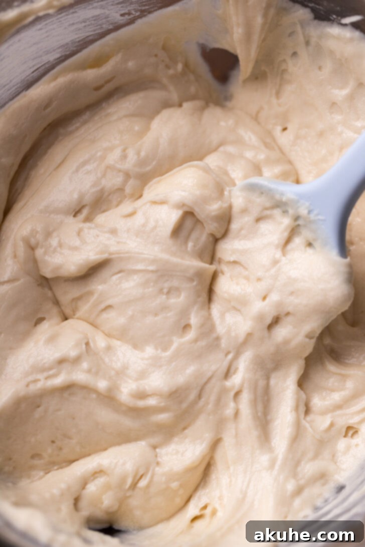 Smooth, creamy cake batter in a bowl, ready for baking.