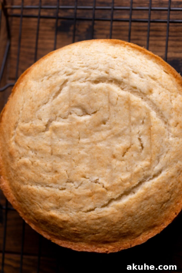 Baked cake cooling on a wire rack.
