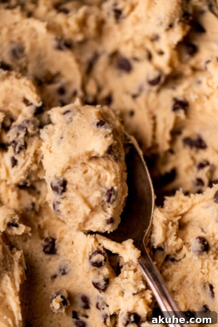 Ready-to-Eat Cookie Dough 3 Spoon with a bite of dough on it.