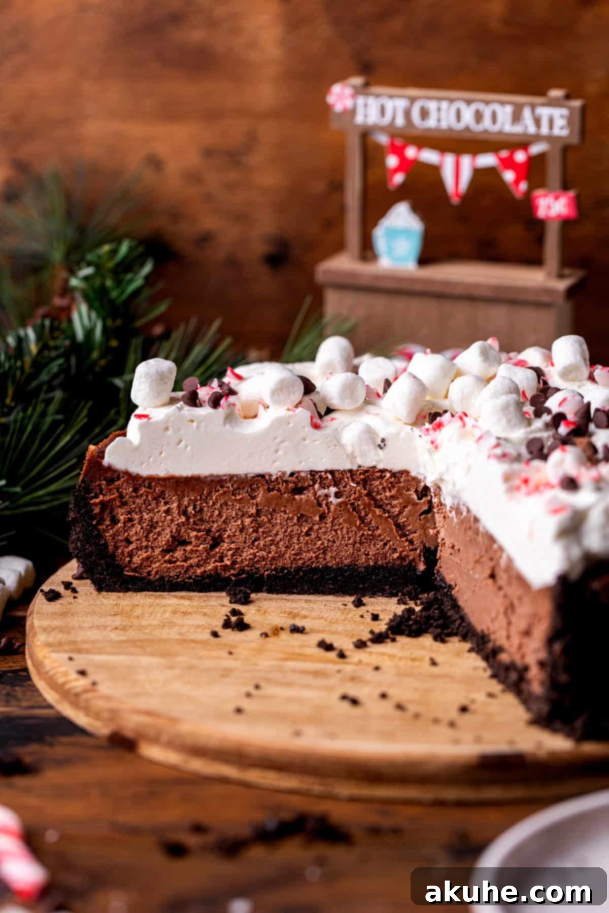 Decadent Hot Chocolate Cheesecake 3 Side view of a tall, perfectly baked hot chocolate cheesecake, showcasing its distinct layers and appealing height.