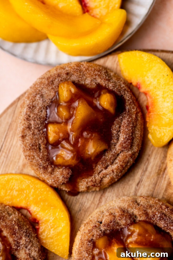 Delectable Peach Cobbler Cookies 10 Overhead shot of a single peach cobbler cookie, showcasing its vibrant peach filling and cinnamon sugar coating.