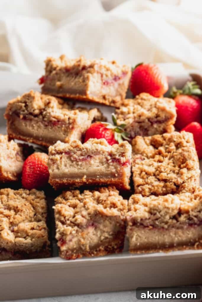 Nostalgic Peanut Butter and Jelly Cheesecake Bars 11 A container filled with delicious peanut butter and jelly cheesecake bars, ready to be enjoyed