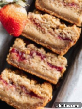 Nostalgic Peanut Butter and Jelly Cheesecake Bars 12 Close up of peanut butter and jelly cheesecake bars