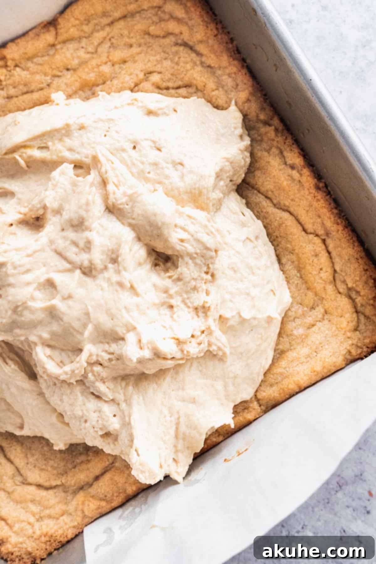 Nostalgic Peanut Butter and Jelly Cheesecake Bars 6 Smooth peanut butter cheesecake batter spread over the baked cookie crust, ready for the next layer