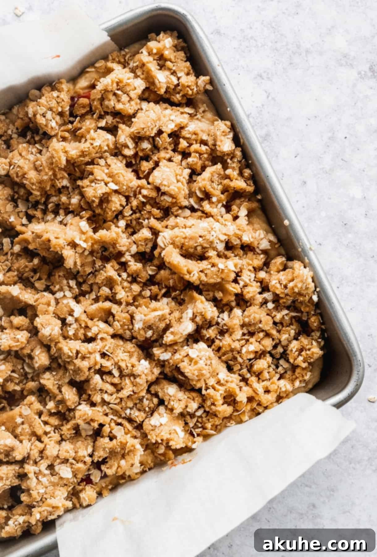 Nostalgic Peanut Butter and Jelly Cheesecake Bars 8 Peanut butter oat crumble sprinkled generously on top of the strawberry jam layer on the cheesecake