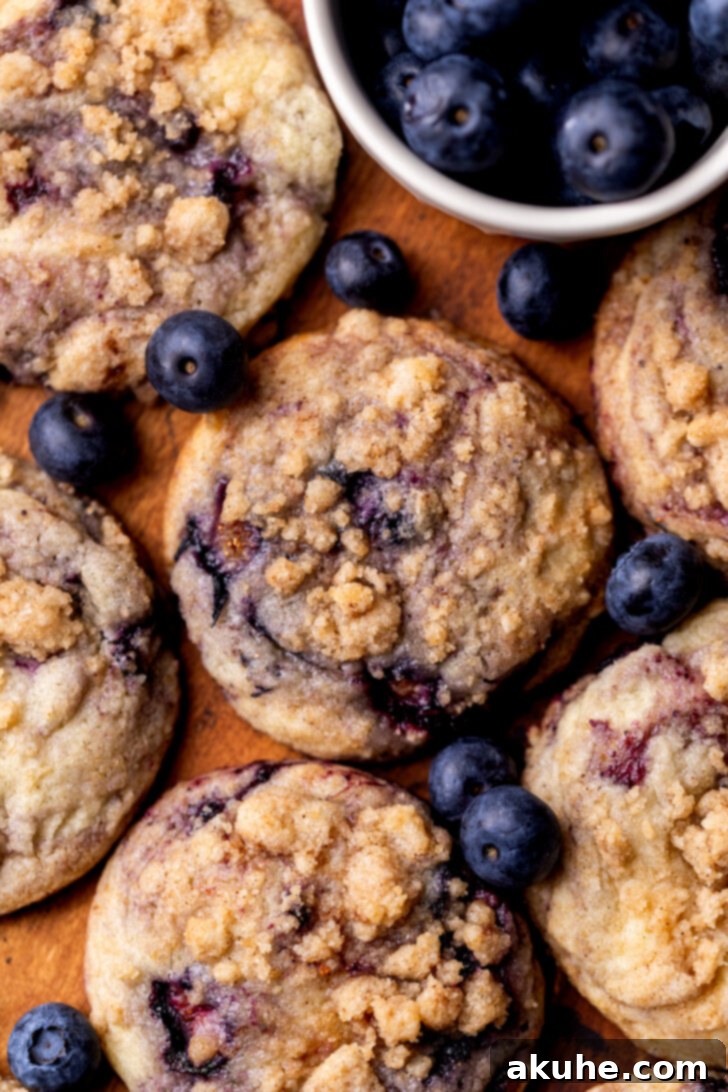 Blueberry Muffin Dream Cookies 3 Top-down view of blueberry muffin cookies showcasing the streusel and blueberry inclusions.