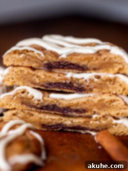 Stack of two cinnamon roll cookies split in half.