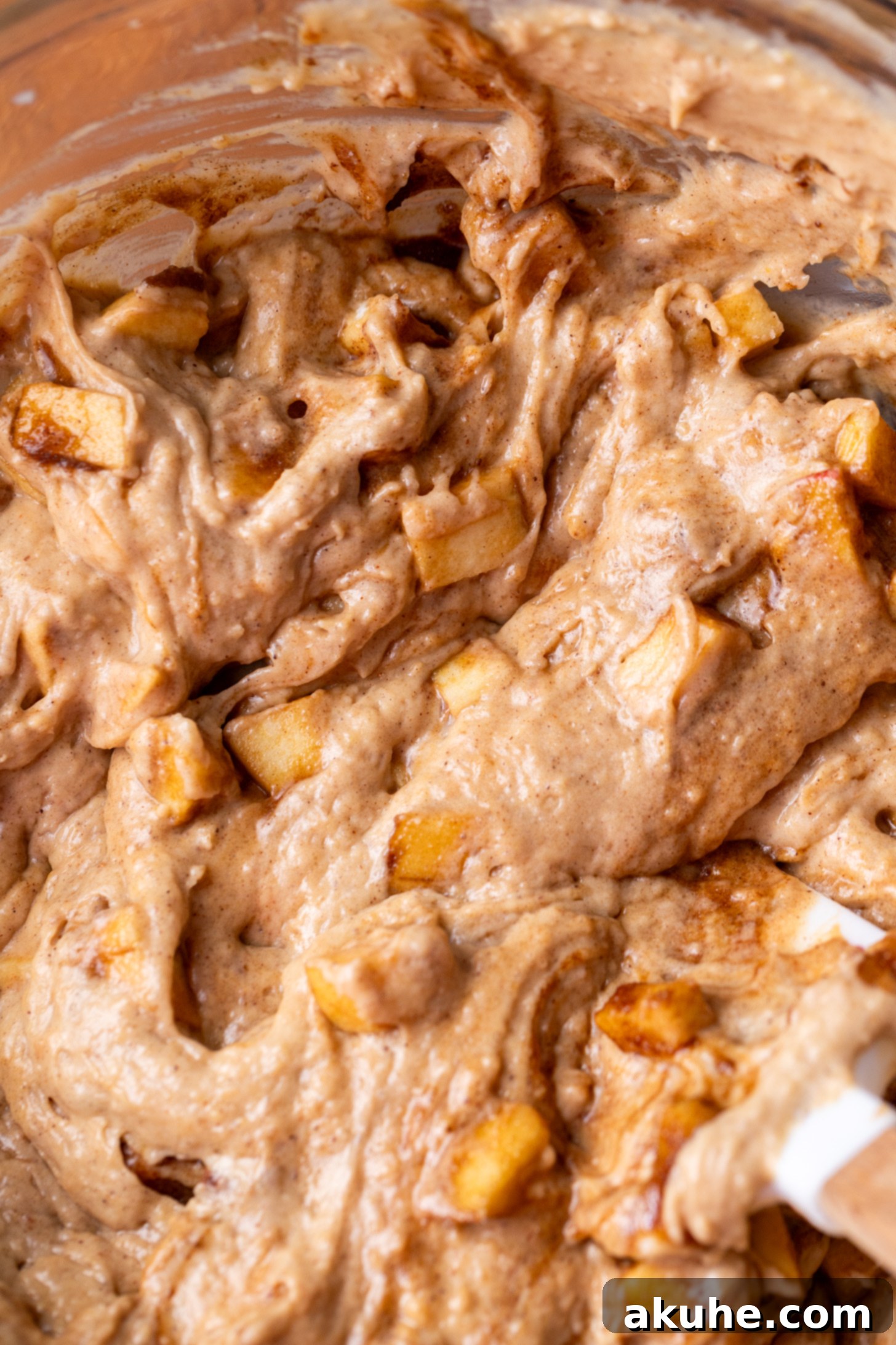 Spiced Apple Bread 7 Smooth apple bread batter waiting in a bowl before being transferred to the prepared loaf pan for baking.