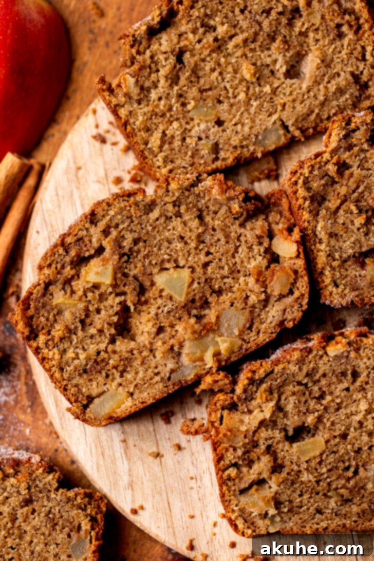 Spiced Apple Bread 9 Overhead shot of multiple slices of golden-brown apple bread, showcasing the cinnamon sugar crust.