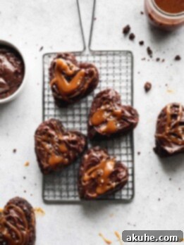 Heart shaped brownies on a wire grate.