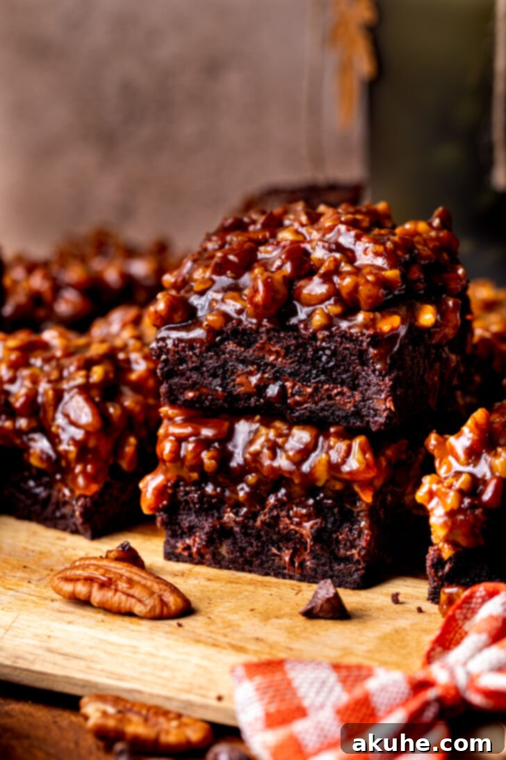 Decadent Pecan Pie Brownies 8 Stack of two pecan pie brownies.