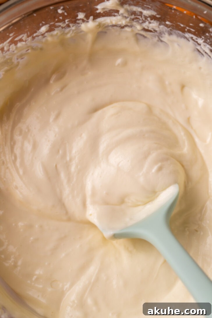 Autumn Pumpkin Cheesecake Cake 5 Cheesecake batter in a bowl, smooth and creamy.