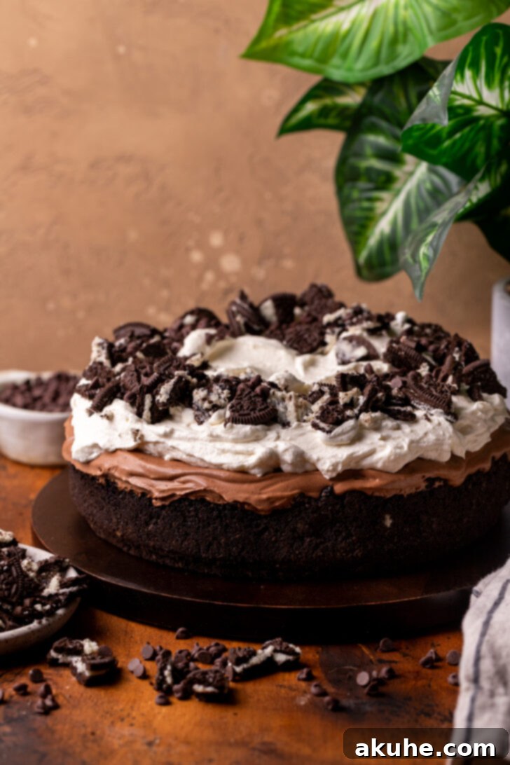 Deep South Chocolate Decadence 8 A fully decorated Mississippi Mud Pie on a wooden board, ready to be served.