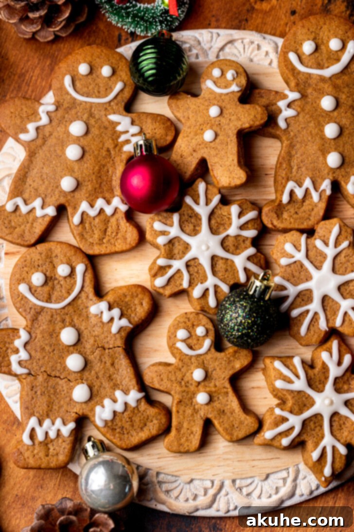 Irresistibly Soft Gingerbread 2 Top view of soft gingerbread cookies, decorated beautifully with vanilla icing, showcasing their festive appeal.