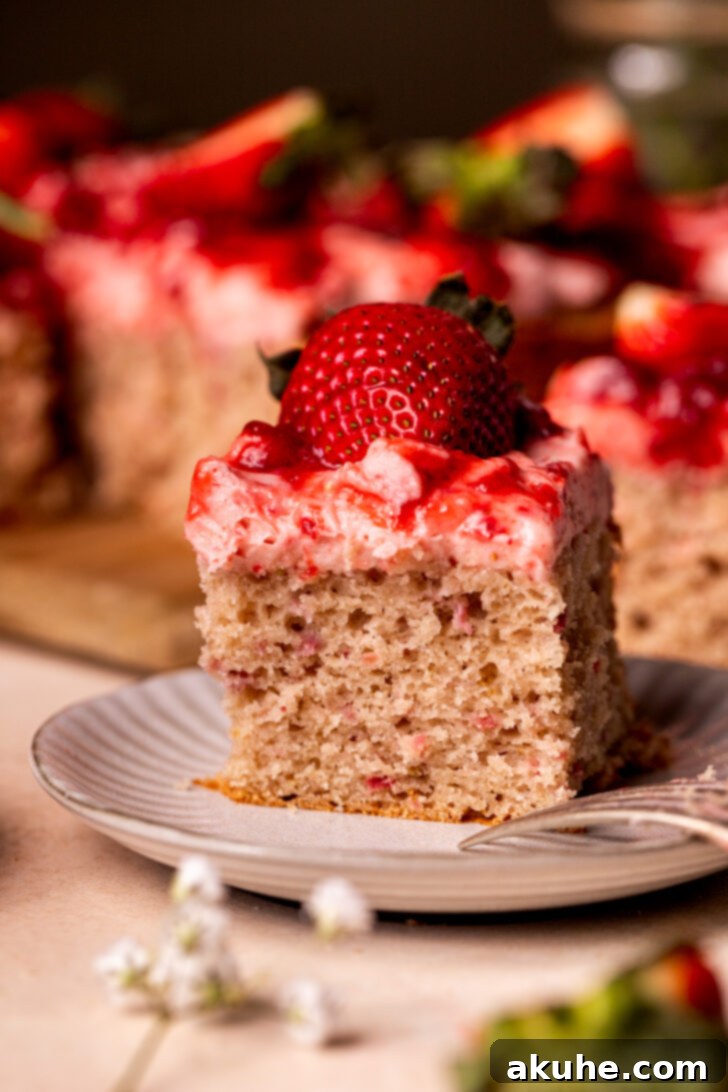Perfect Fresh Strawberry Cake 14 A single, inviting slice of strawberry cake served on a plate, ready to be enjoyed.