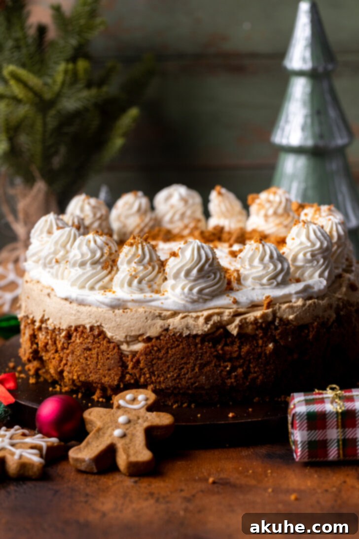 Decorated no-bake gingerbread cheesecake resting on a rustic wood board, ready to be served.