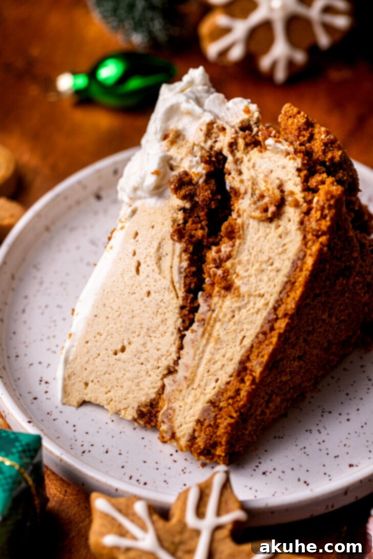 A perfectly cut slice of no-bake gingerbread cheesecake lying on its side, revealing its layers.