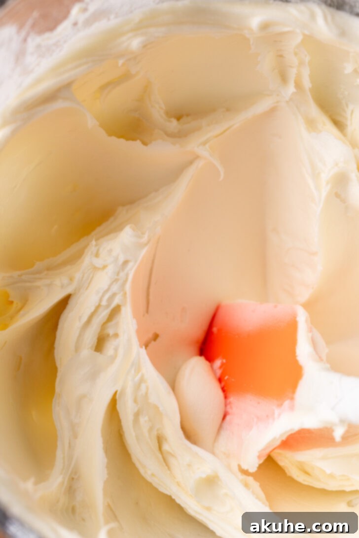 Warm Gingerbread Delights 6 Smooth, fluffy cream cheese frosting in a mixing bowl, freshly prepared.