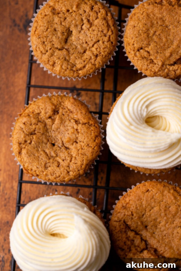 Warm Gingerbread Delights 7 A tray of freshly baked gingerbread cupcakes with and without two layers of cream cheese frosting.