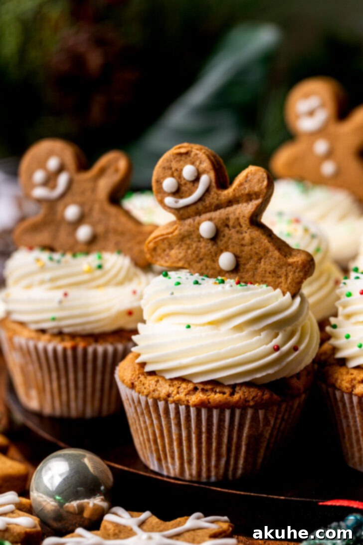 Warm Gingerbread Delights 8 A delightful array of gingerbread cupcakes elegantly arranged on a rustic wooden board.