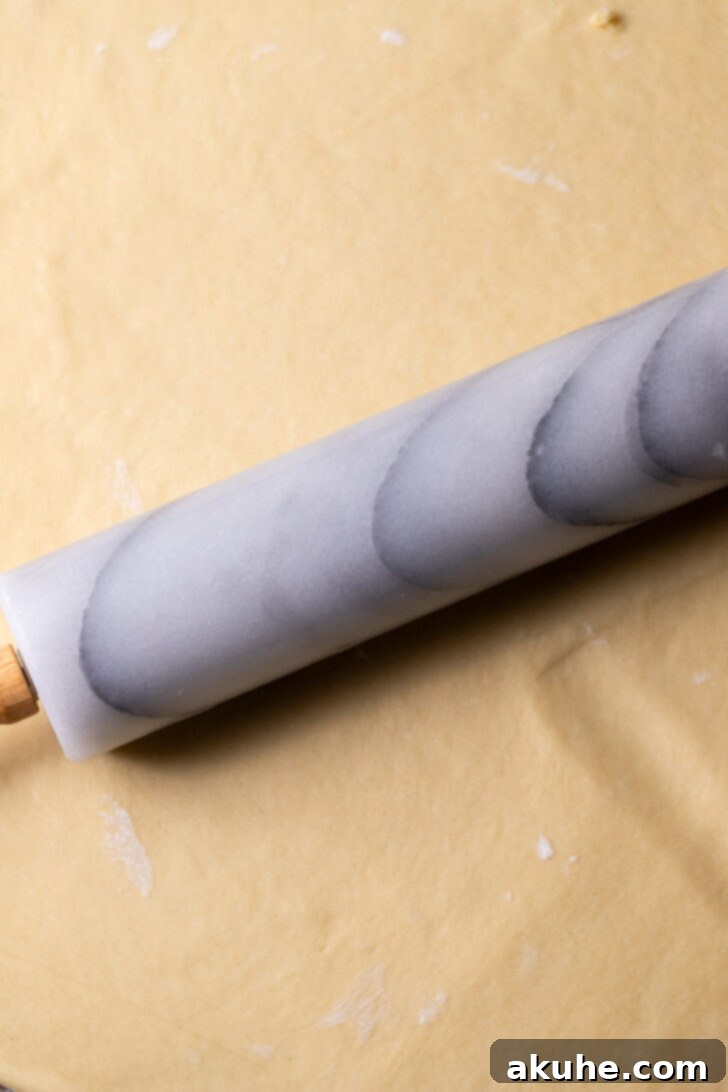 Festive Eggnog Swirls 4 Rolling out the eggnog dough into a large rectangle after its first rise.