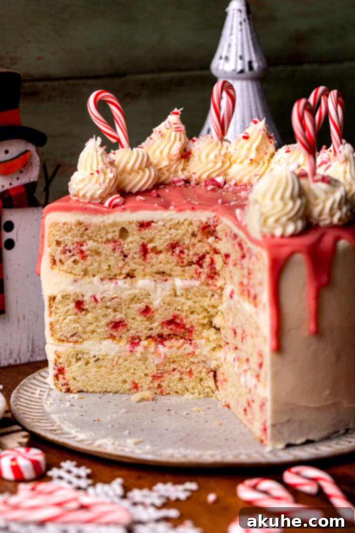 White chocolate peppermint cake opened up on a platter, showcasing its festive layers and irresistible appeal.