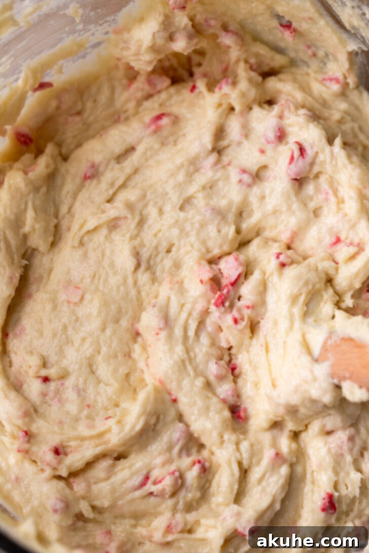 Cake batter in a bowl, visibly thick and creamy, ready for baking.