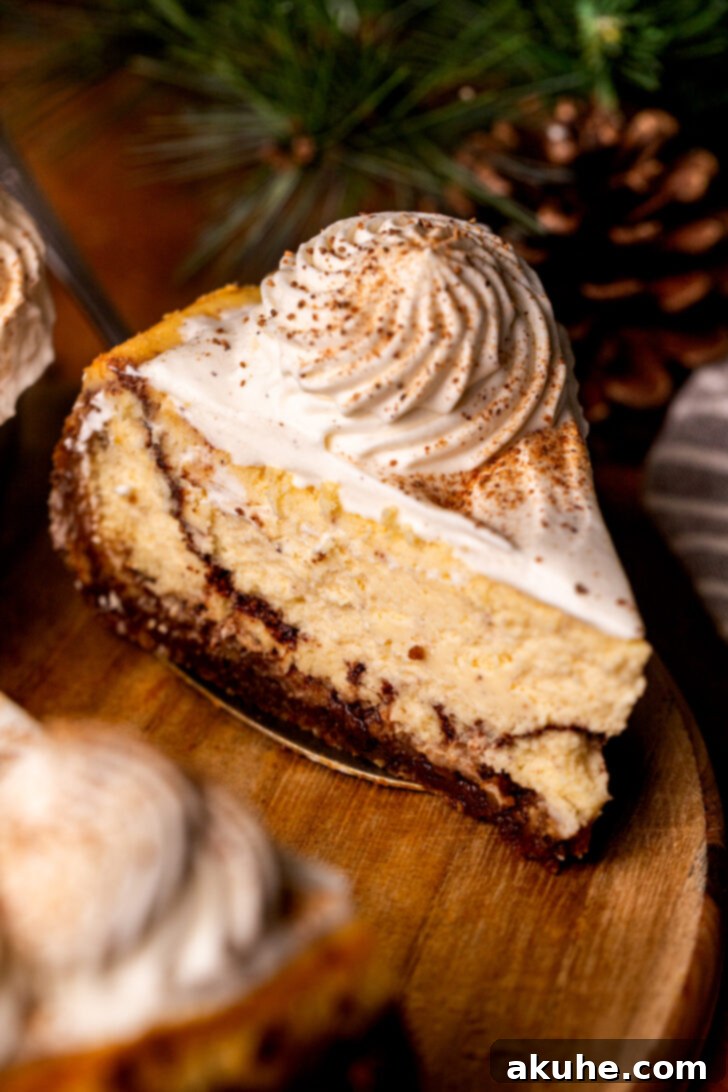 Eggnog Dream Cheesecake 2 Slice of eggnog cheesecake on a wood platter.